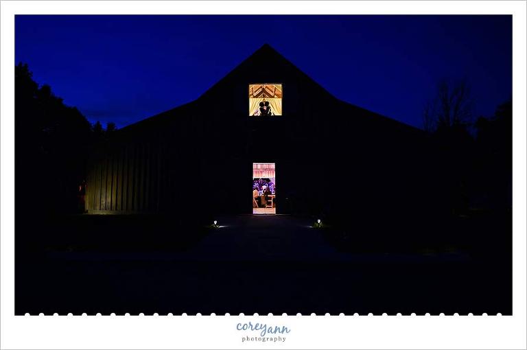 bride and groom silhouette at barn during wedding reception in medina ohio