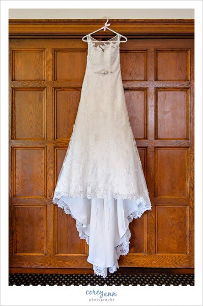 brides dress hanging before wedding