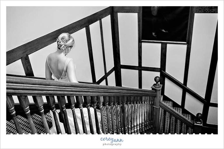bride walking down steps at mayfield club