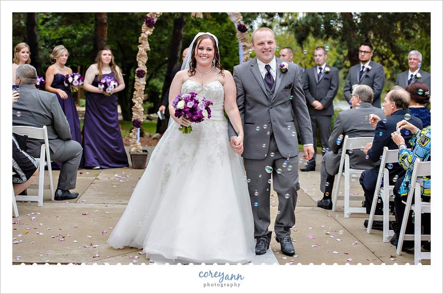 wedding ceremony processional with bubbles at  williams on the lake in medina