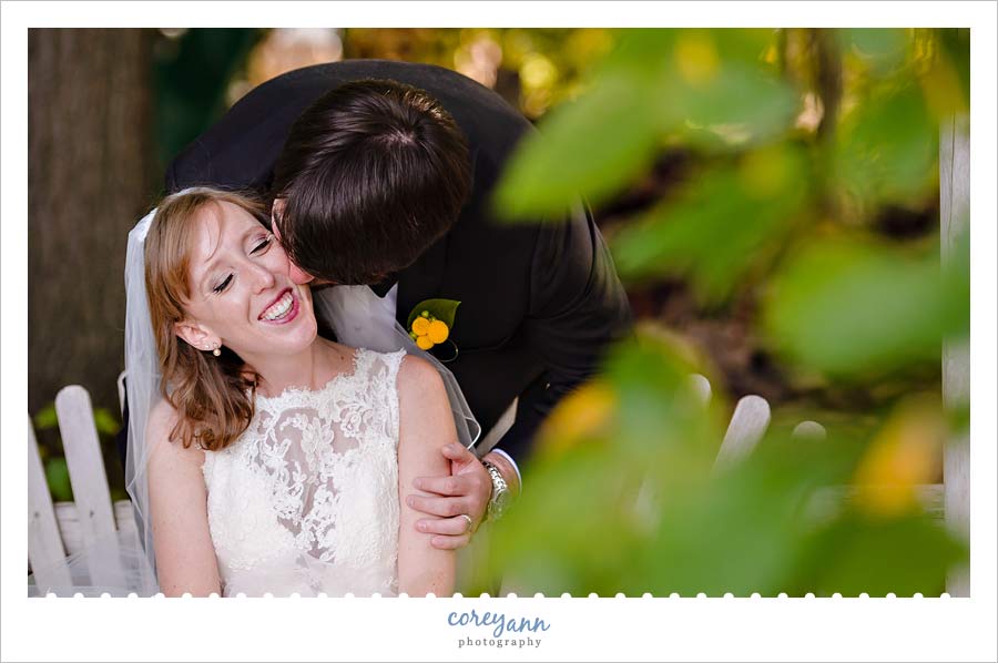 groom kissing bride's cheek