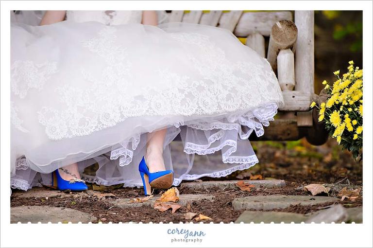 bride's blue heels with wedding dress