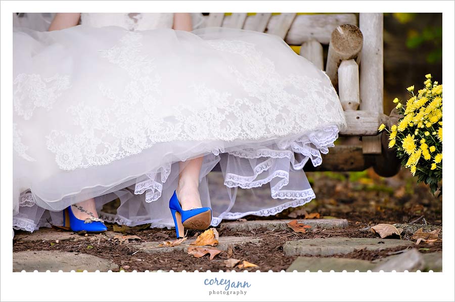 bride's blue heels with wedding dress