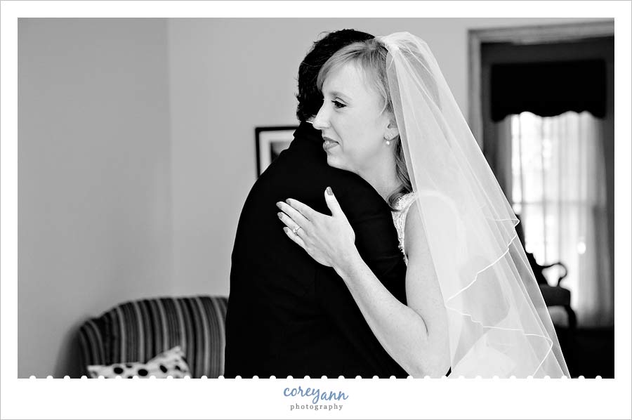 bride hugging father after he sees her for the first time
