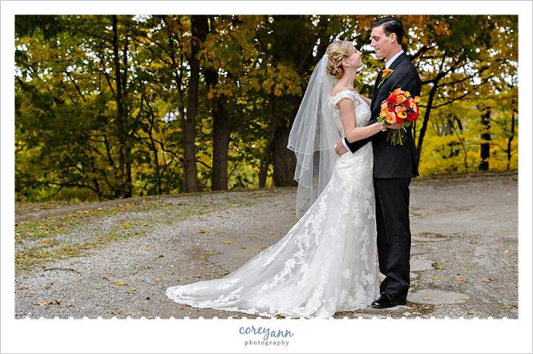 bride and groom with fall foliage in northeast ohio
