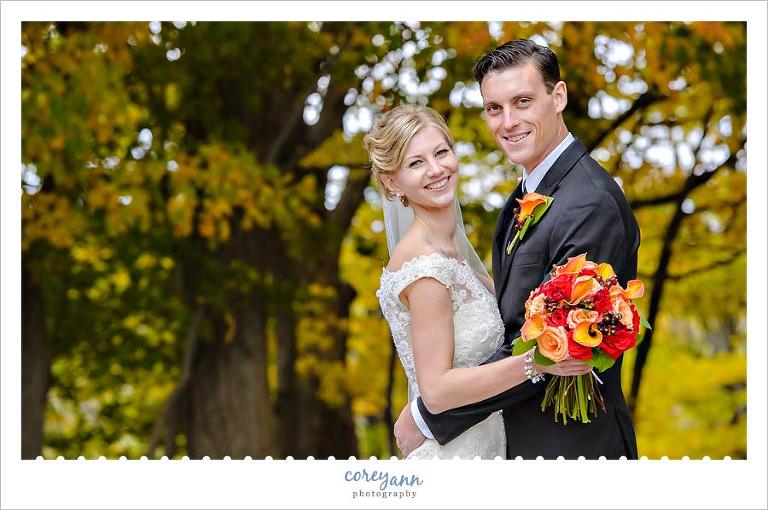 bride and groom with foliage at rocky river reservation