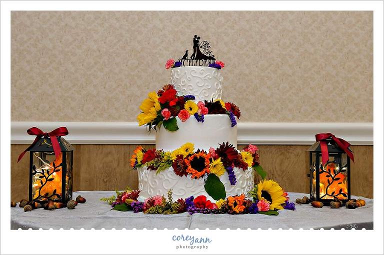 wedding cake with silhouette topper with dog and bride and groom