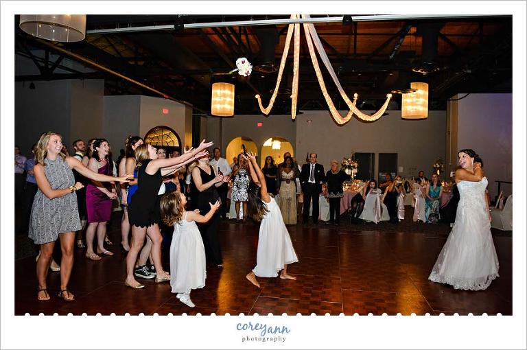 tossing the bouquet at wedding reception in cleveland