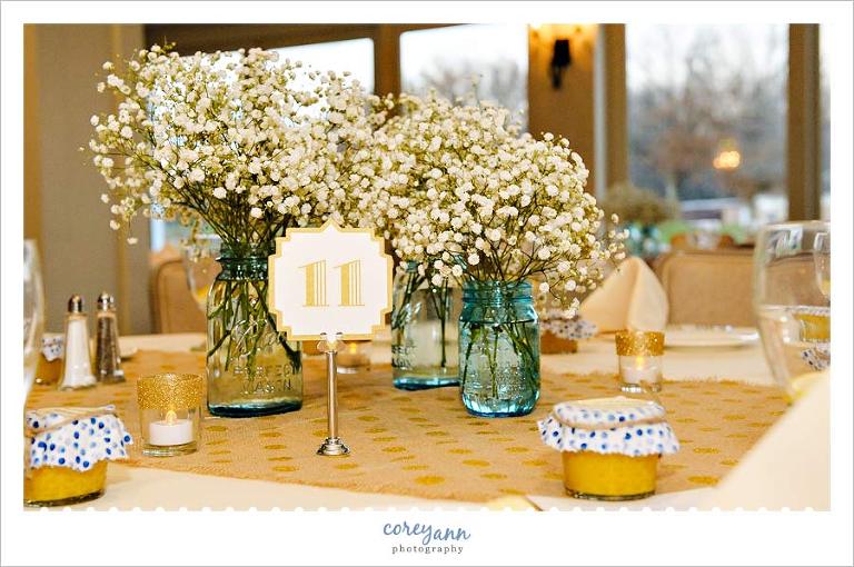 baby's breath and blue mason jar wedding reception decor