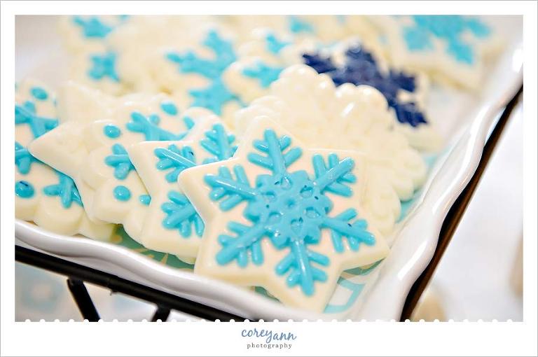 blue and white snowflake chocolate treats at winter wedding reception