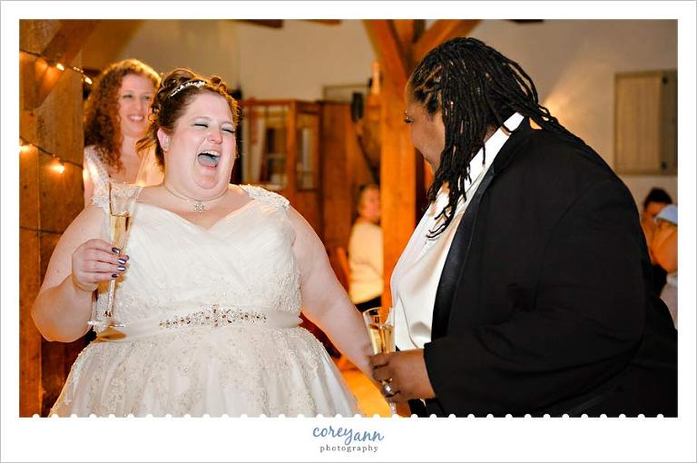 brides laughing during wedding toast