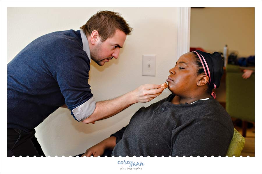 bride getting makeup put on before wedding
