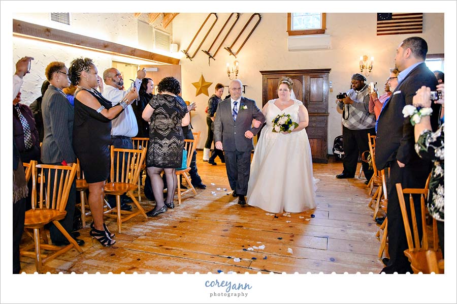 bride being escorted up the aisle by her father at bittersweet farm