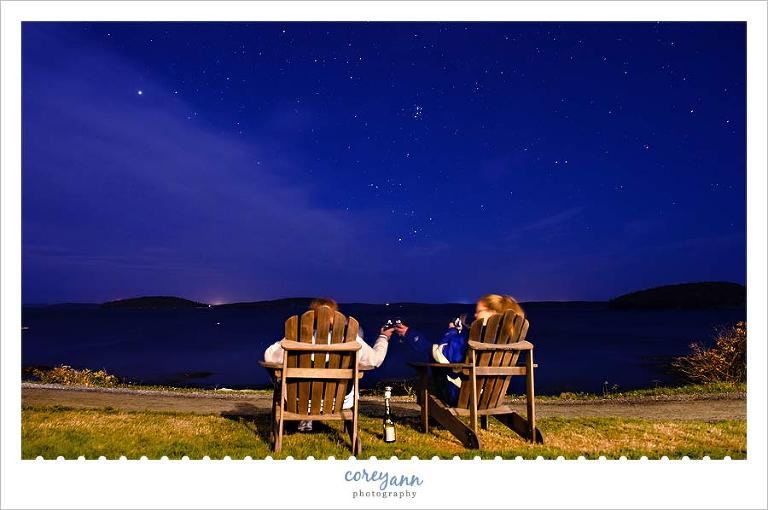 Friends sharing prosecco under the starry sky