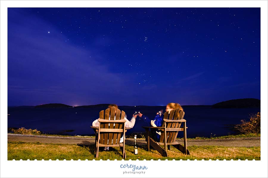 Friends sharing prosecco under the starry sky