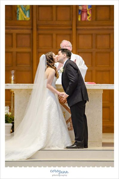 First Kiss During Catholic Wedding Ceremony