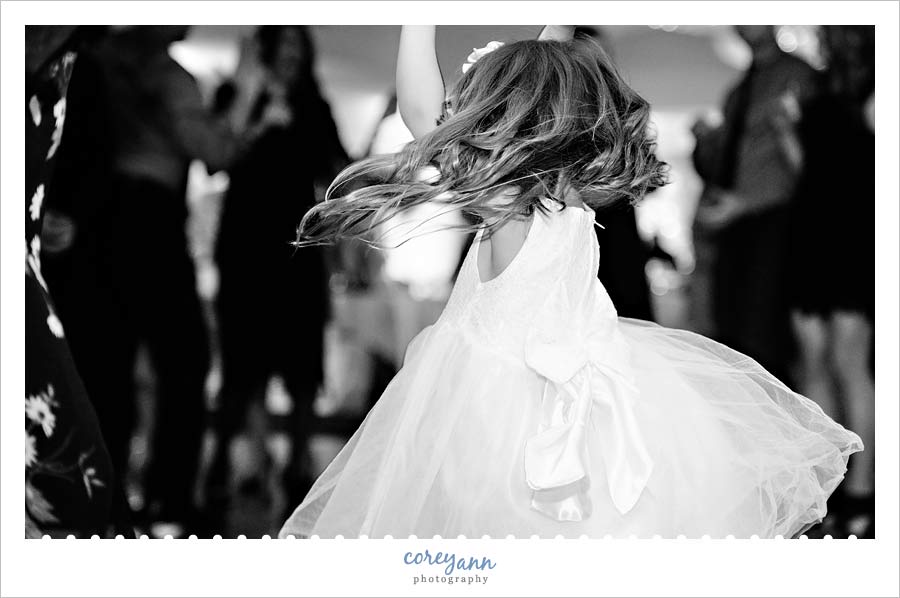 Flower girl on the dance floor twirling while laflavour plays
