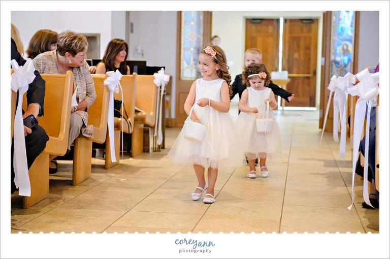 Flower girls dropping petals on ground before wedding at Walsh University