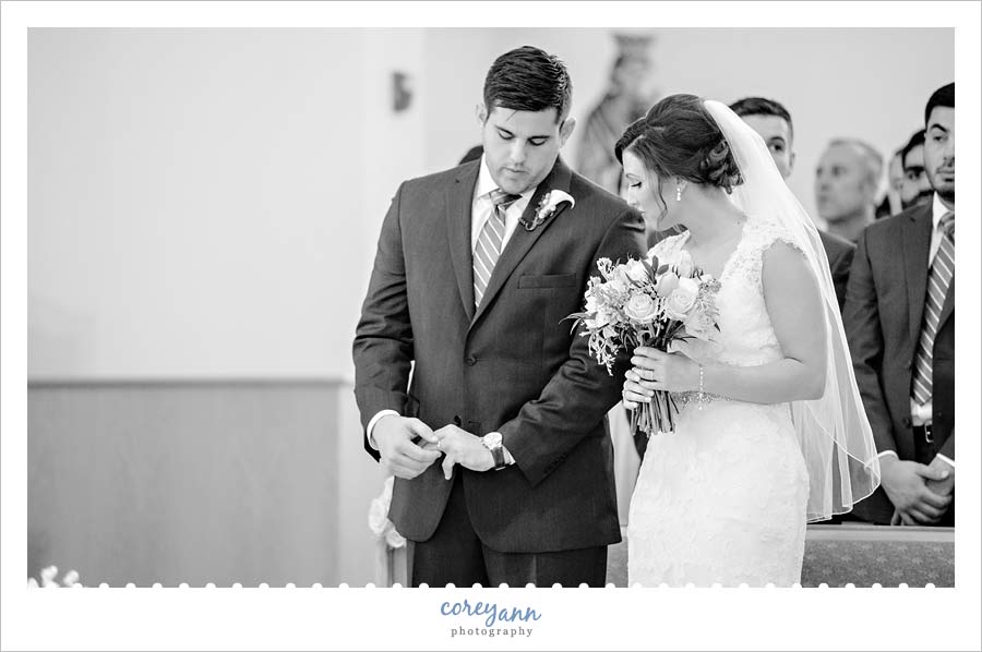Groom looking at new wedding ring