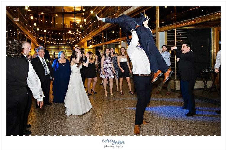 Guests doing a dirty dancing style lift at the wedding reception