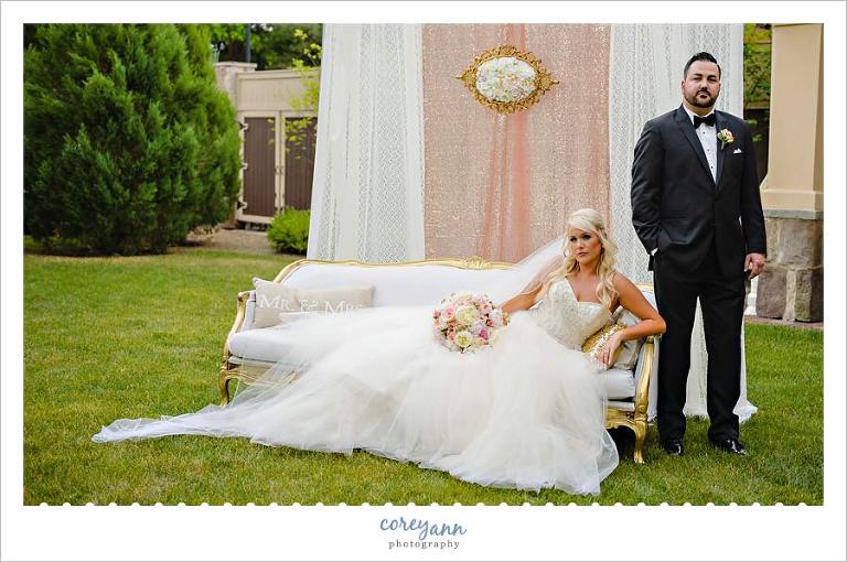 Bride and Groom posing on couch