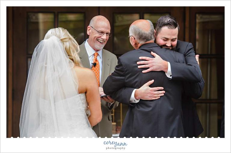 Groom hugging father in law 