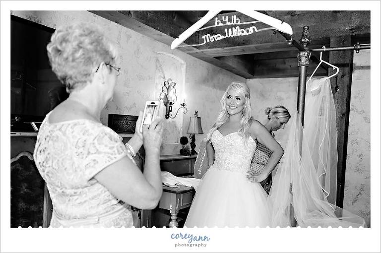 Bride posing for picture when getting ready at Gervasi