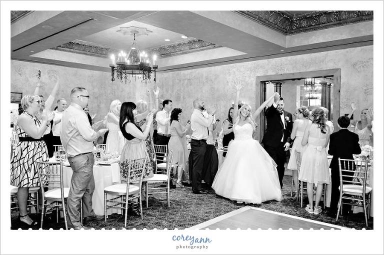 Bride and groom enter into wedding reception in northeast ohio