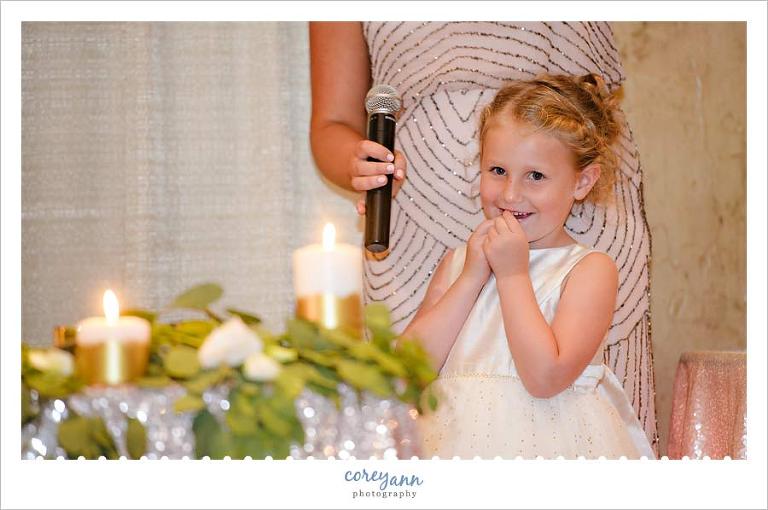 Flower Girl giving toast at wedding reception