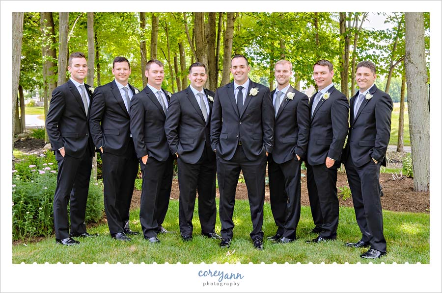 Groomsman in black suits for wedding attire