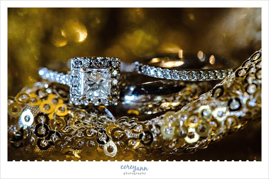 Wedding Rings on gold glitter tablecloth from event source rentals in Cleveland Ohio