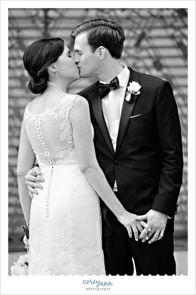 Black and White Portrait of Bride and Groom Kissing