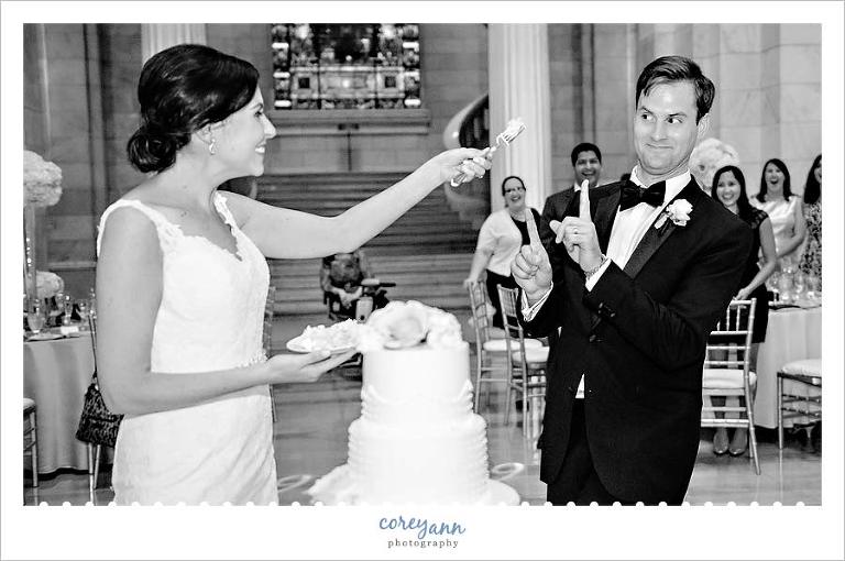 Bride and Groom cutting the cake during wedding reception in Cleveland