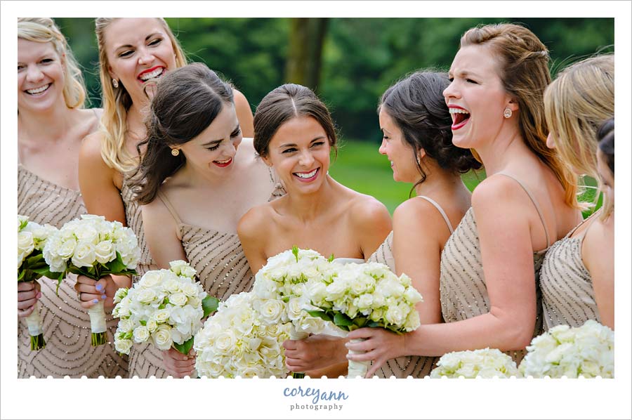 Bride and bridesmaids laughing 
