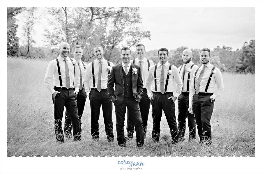 Men standing in a field of grass