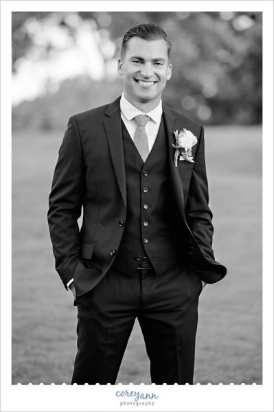 Groom wearing J Crew suit on wedding day in Canton OH