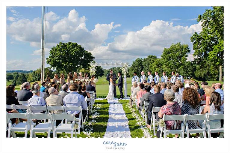 Outdoor wedding ceremony at brookside country club