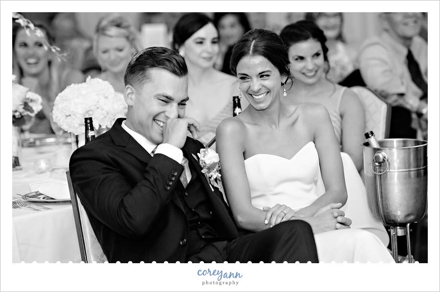 Bride and Groom laughing during toasts