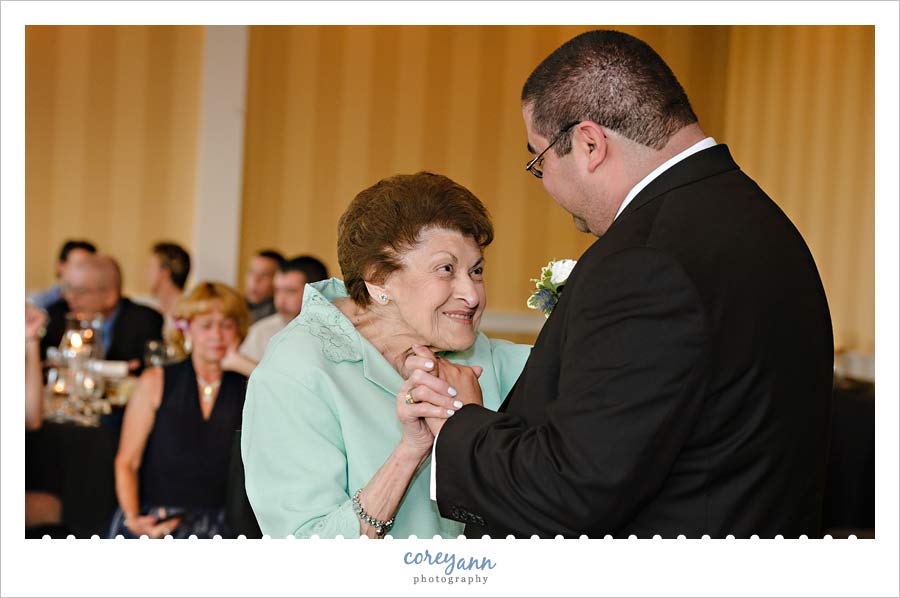Grandmother and Son dance during wedding reception