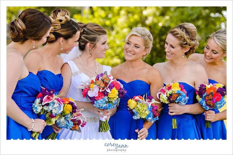 Bride and bridesmaids with multi colored bouquets