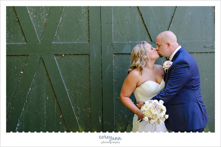 Bride and Groom in front of barn in Rocky River Reservation