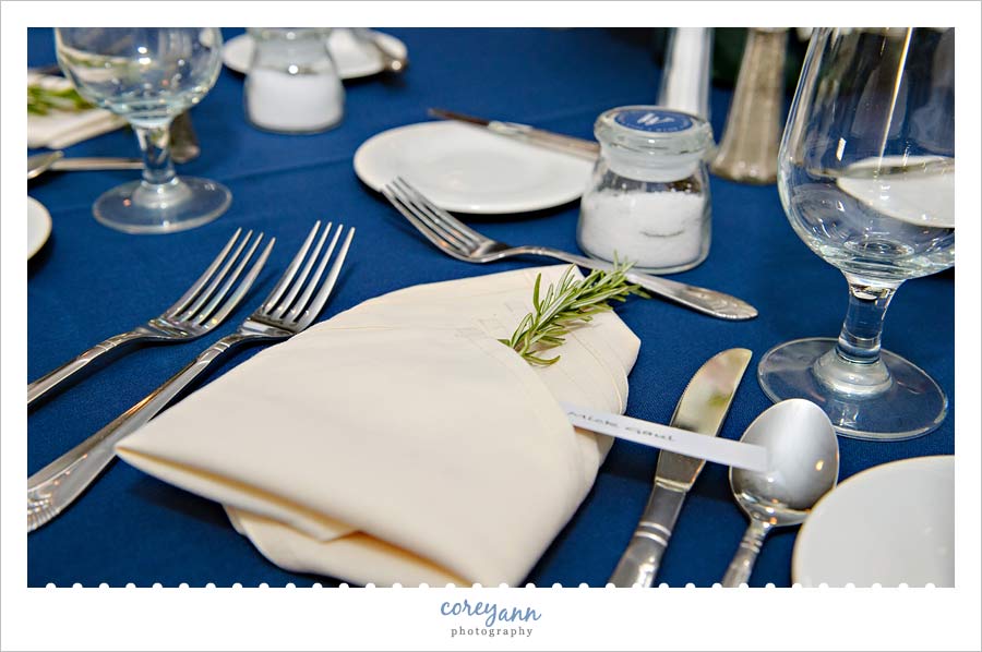 Rosemary tucked into napkin at place setting