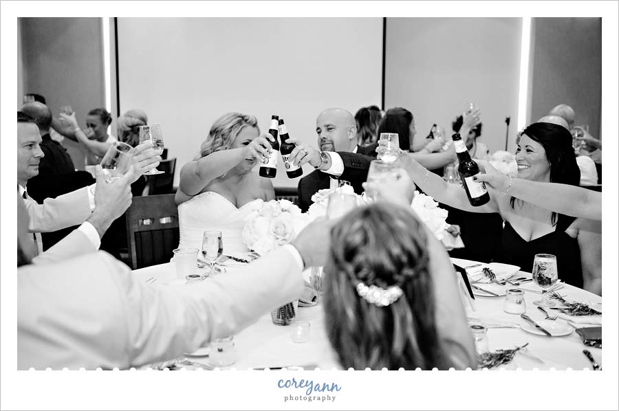Bride and Groom toasting at wedding reception at the cleveland yacht club