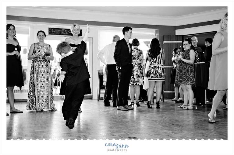 ring bearer dancing at wedding reception