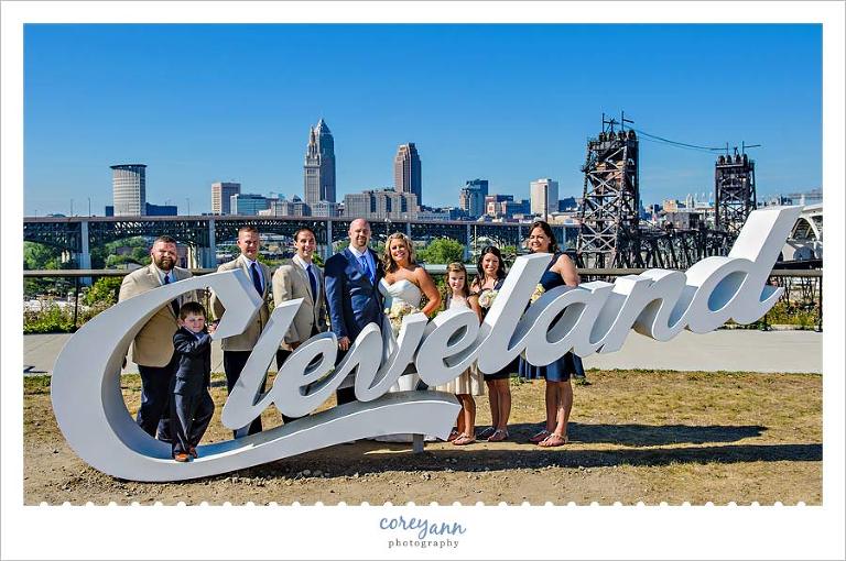 Wedding Party at Cleveland sign in Tremont