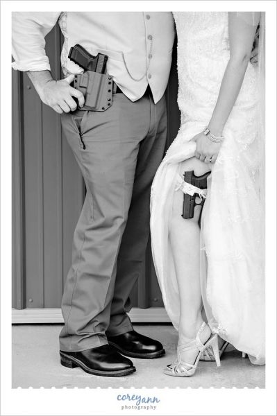 Bride and Groom with guns in holsters