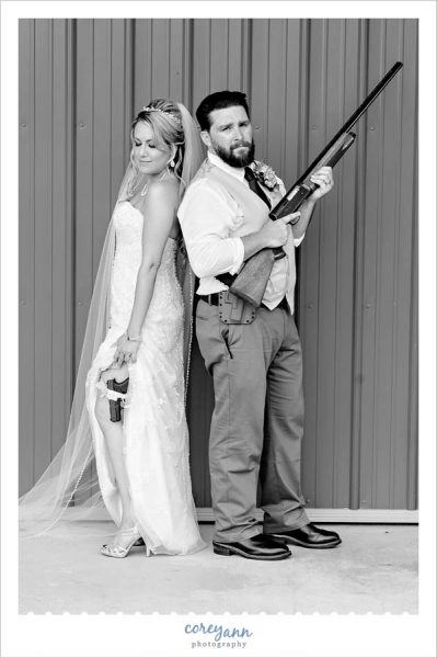 Bride and Groom pose with guns
