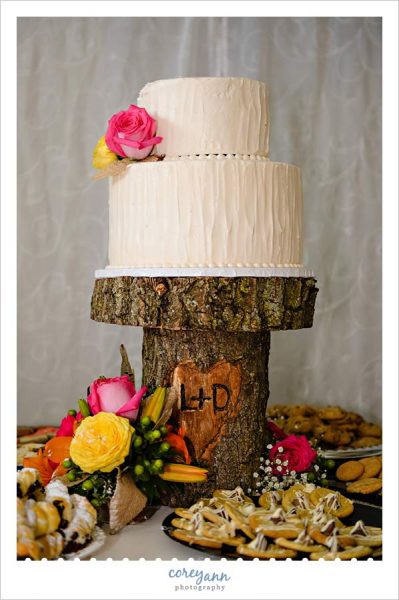 wedding cake on custom carved wood stand
