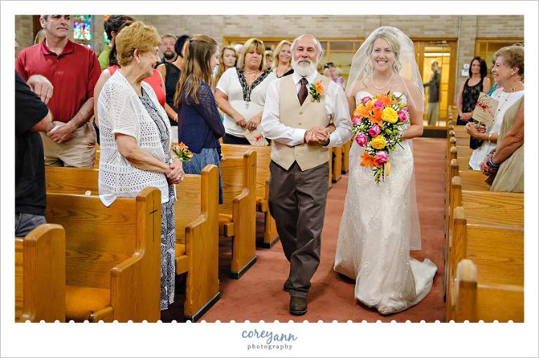 bride and father walk down the aisle in north lawrence
