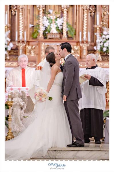 First Kiss after wedding ceremony at St John Cantius Roman Catholic Church in Tremont